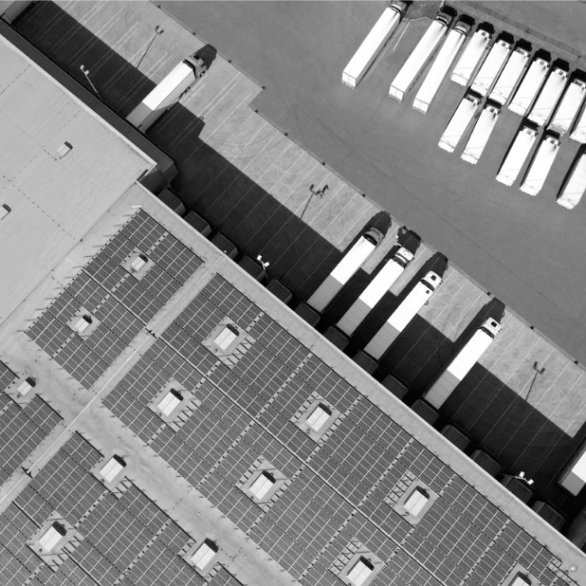 Aerial view of solar panels over a truck garage