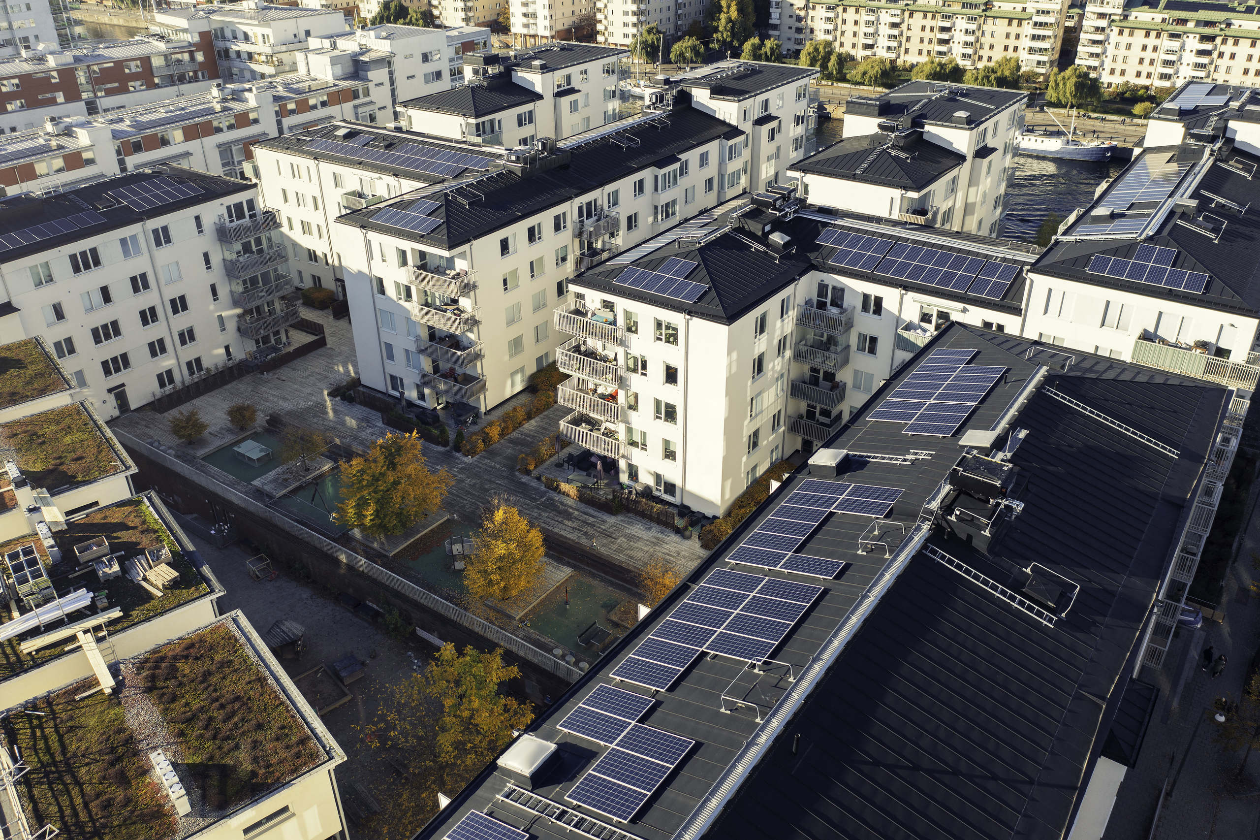 Apartment buildings with solar panels on the roof tops